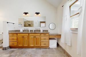 a bathroom with a sink and a mirror at High Street Retreat in Cavendish +37 photos