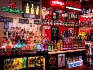 a bar with a lot of different types of alcohol at The Kings Cross Hotel in Blackpool