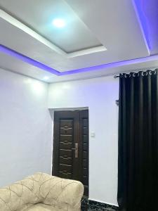 a room with a couch and a black curtain at Executive villa in Aja