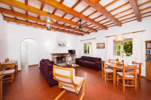 a living room with a couch and a table at Villa Trepuco Dos in Punta Prima
