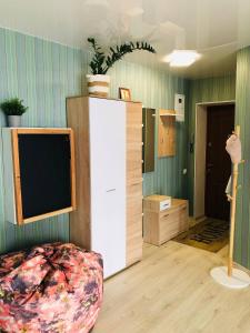 a room with a tv and a bed in a room at Apartment VV in Volodymyr-Volynskyi