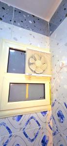 a room with a window with a fan on the ceiling at Solara in Hurghada +48 photos