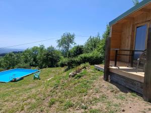 a house on a hill with a swimming pool at Cedre bleu in Saint-Racho