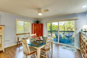 a kitchen and dining room with a table and chairs at Pool Access! Private Island Condo in Placida in Placida
