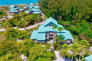 an overhead view of a house with blue roofs at Pool Access! Private Island Condo in Placida in Placida