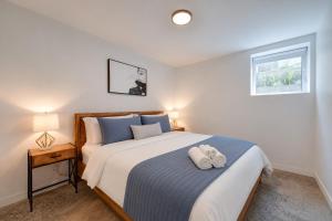 a bedroom with a bed with a stuffed animal on it at Amazing 2BR condo with private terrace presented by TripMontreal II in Montreal