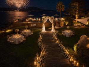 a wedding set up on a dock with lights at Sofitel Golfe d'Ajaccio Thalassa Sea & Spa in Ajaccio