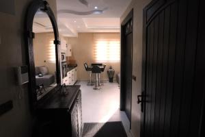 a room with a hallway with a mirror and a table at Tamraght Ocean View in Tamraght Ouzdar +45 photos