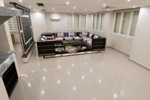 a living room with a couch in a room at Tamraght Ocean View in Tamraght Ouzdar