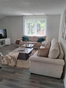a living room with a couch and a table at Vila jajcegrad in Jajce