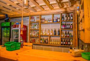a bar with a lot of bottles of alcohol at Almasi lounge in Arusha