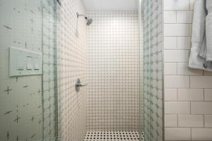a shower with a glass door in a bathroom at 1628 West Oceanfront Oasis 6 in Newport Beach +22 photos