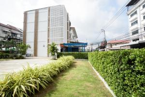 a hedge in front of a building at MINI Plume Minburi in Min Buri