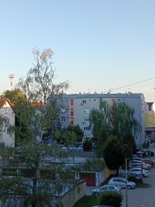 a view of a parking lot with a building at Studio apartman LUNA in Vinkovci