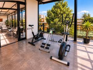 a gym with two treadmills and two exercise bikes at Casa de Avila Hotel in Arequipa