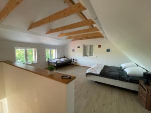 a bedroom with a large bed in a attic at Ferienhaus Calle in Bücken