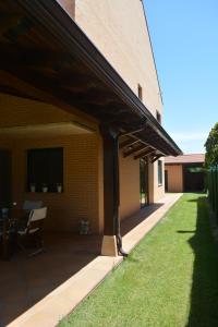 an external view of a building with a patio at Casa Río Tera in Garray