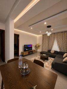 a living room with a table and a couch at Djess service in Abidjan