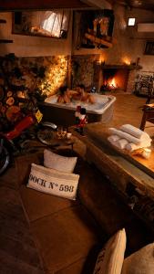 a large room with two people in a tub at LARCADE Loft Industrial-Jacuzzi in Castillo de Bayuela +60 photos