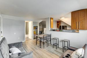 a living room and kitchen with a couch and a table at Train to Philly! Pet-Friendly Unit in Barrington in Barrington
