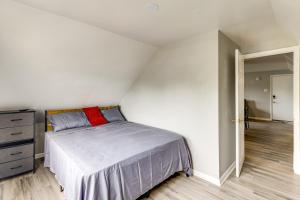 a bedroom with a bed and a dresser at Train to Philly! Pet-Friendly Unit in Barrington in Barrington