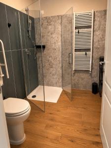 a bathroom with a shower and a toilet at Agriturismo Terra Madre in Rapallo