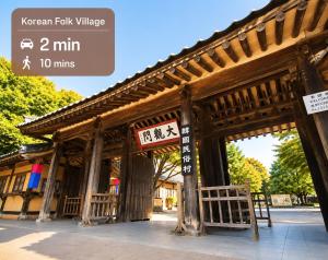 an asian building with a sign in front of it at Jian Stay Bora in Sin'gal