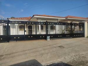 a black fence in front of a building at Chitre Villa by Otium in Monagrillo +5 photos