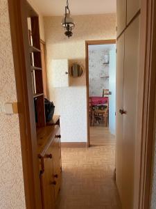 a hallway with a kitchen and a dining room at Appartement Mona Lisa in Ris-Orangis +1 photo