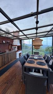 a dining room with a table and some chairs at Azad A-Frame in Şotrile