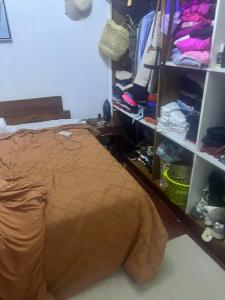 a bedroom with a bed and a closet at Chepchephm in Makindi