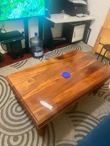 a wooden coffee table in a living room at Chepchephm in Makindi