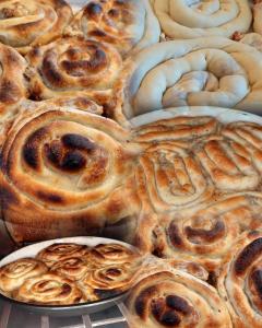 a bunch of cinnamon rolls on a table at Eko park Jelići in Jelići