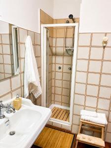 a bathroom with a sink and a shower at Rome Home Cinecittà in Rome
