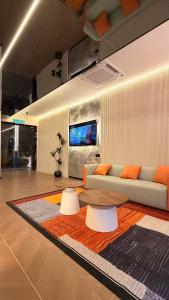 a living room with a couch and a table at THE SWAN loft in Sibu