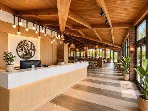 an office lobby with a reception counter and potted plants at Ramada by Wyndham 1000 Islands Gananoque in Gananoque +37 photos