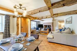 a living room with a table and a couch at 2 Bed in Penrith oc-87349 in Penrith