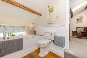a bathroom with a toilet and a bath tub at 2 Bed in Penrith oc-87349 in Penrith +24 photos
