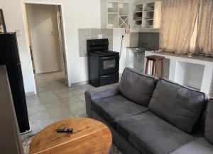 a living room with a couch and a table at Kokoma Apartment in Katima Mulilo in Katima Mulilo