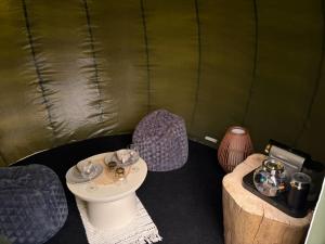 a room with two chairs and a table in a tent at Bubble Tent Altmühltal in Greding