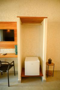 a white box sitting on a table in a room at Desfrute Pousada e Experiencia in Arraial d'Ajuda