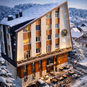 an aerial view of a hotel in the snow at Modern Harmony in Kolašin