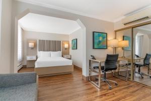 a hotel room with a bed and a desk at Best Western Dorchester Hotel in Nanaimo +53 photos
