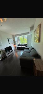 a large living room with a couch and a table at Executive 1 Bedroom Condo sleeps 2 in Toronto +47 photos