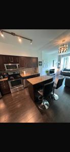 a kitchen with a table and chairs in a room at Executive 1 Bedroom Condo sleeps 2 in Toronto