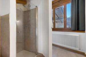 a bathroom with a shower with a glass door at Casa Zucchelli in Tenno +24 photos