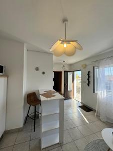 a kitchen with a white counter and a ceiling at Apartment Niko in Pakoštane +10 photos