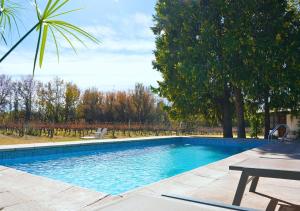 a swimming pool in a yard with a picnic table at Postales by DOT Boutique in Colonia Las Rosas