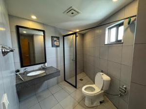 a bathroom with a toilet and a sink and a mirror at Executive 2 bedrooms in Rawalpindi - Self Checkin in Rawalpindi