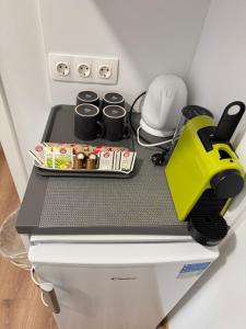 a kitchen with a counter top on top of a refrigerator at Tóranéző Ház in Balatongyörök